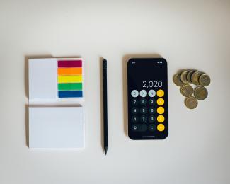 black iphone 4 beside black and silver remote control by Amol Tyagi courtesy of Unsplash.