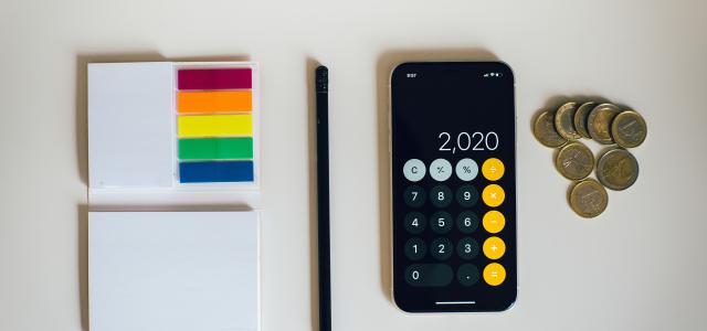 black iphone 4 beside black and silver remote control by Amol Tyagi courtesy of Unsplash.